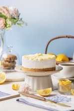 A cake sitting on top of a white cake plate