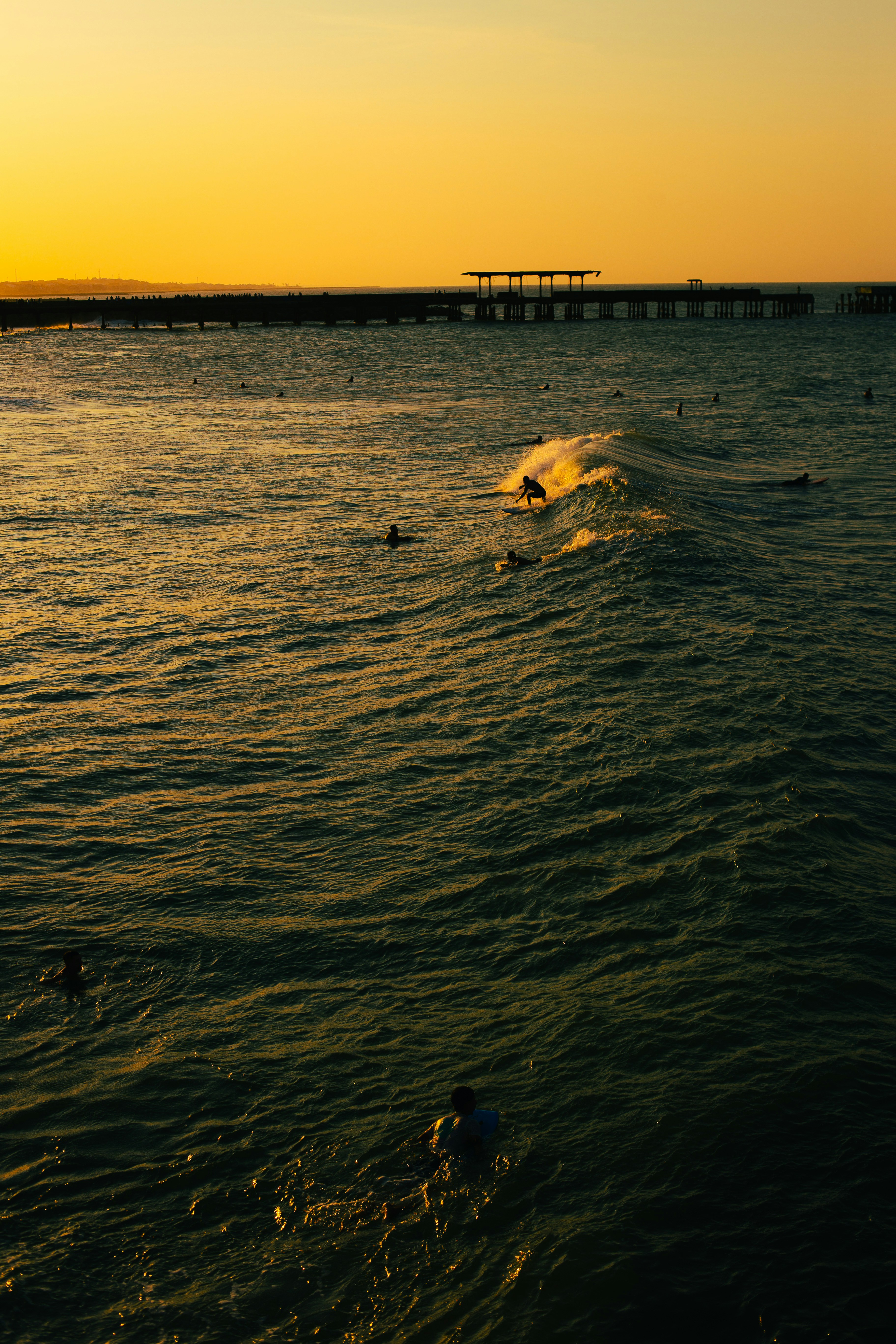 A body of water with people swimming in it