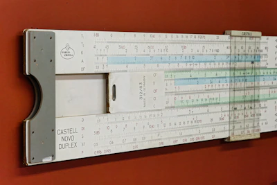 A large ruler mounted to the side of a wall