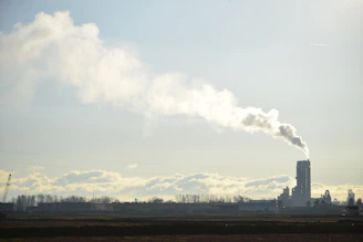 A factory with smoke coming out of it