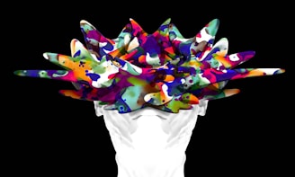 A person holding a bunch of colorful objects in their hands