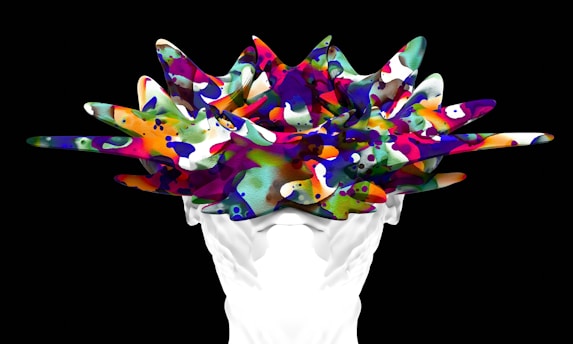A person holding a bunch of colorful objects in their hands