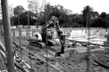 A black and white photo of a construction site
