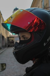 A woman wearing a helmet on a street