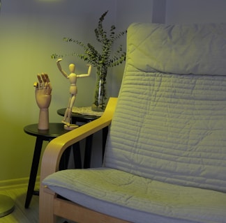A living room with a couch, table and lamp