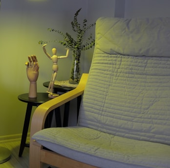 A living room with a couch, table and lamp