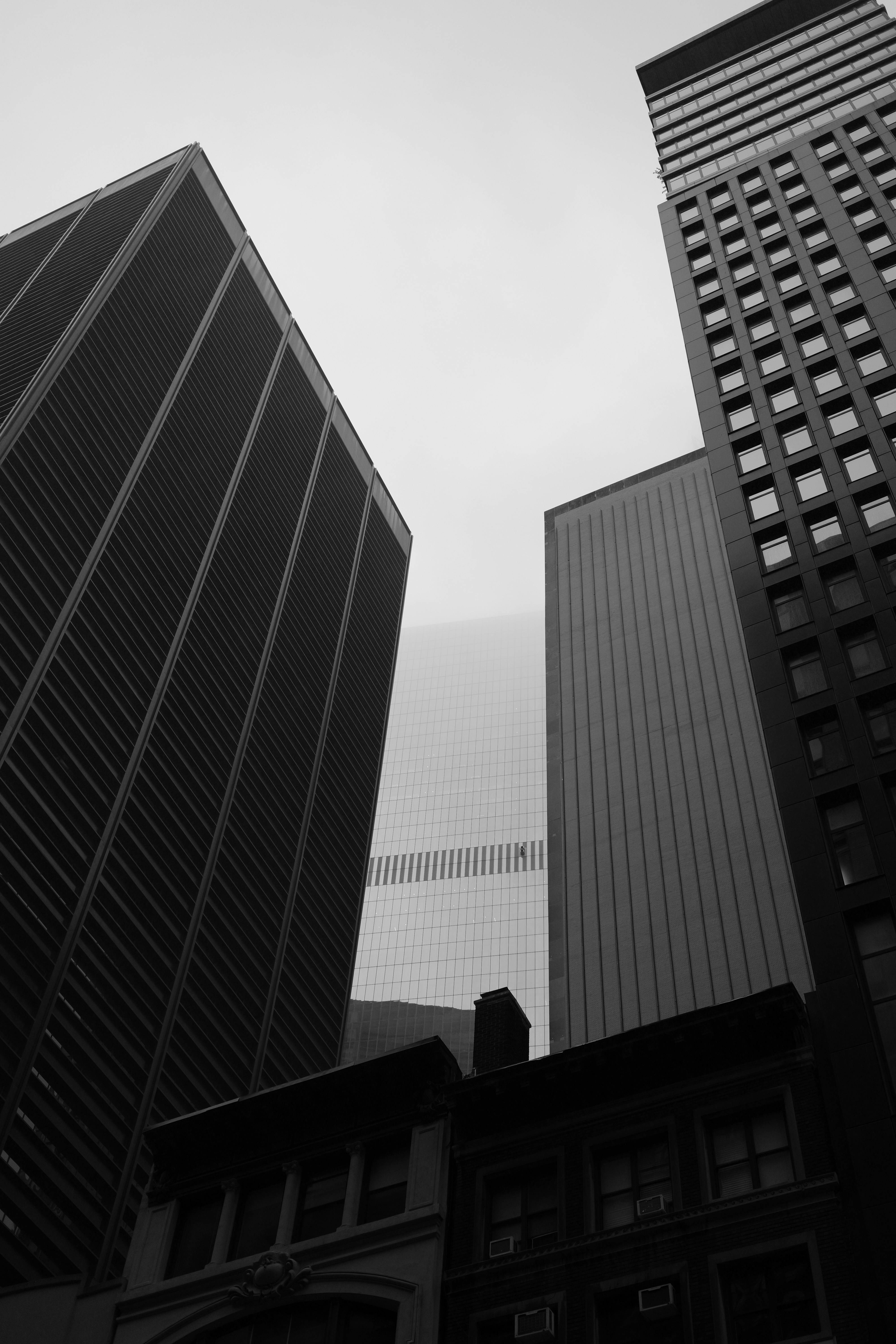 A black and white photo of tall buildings