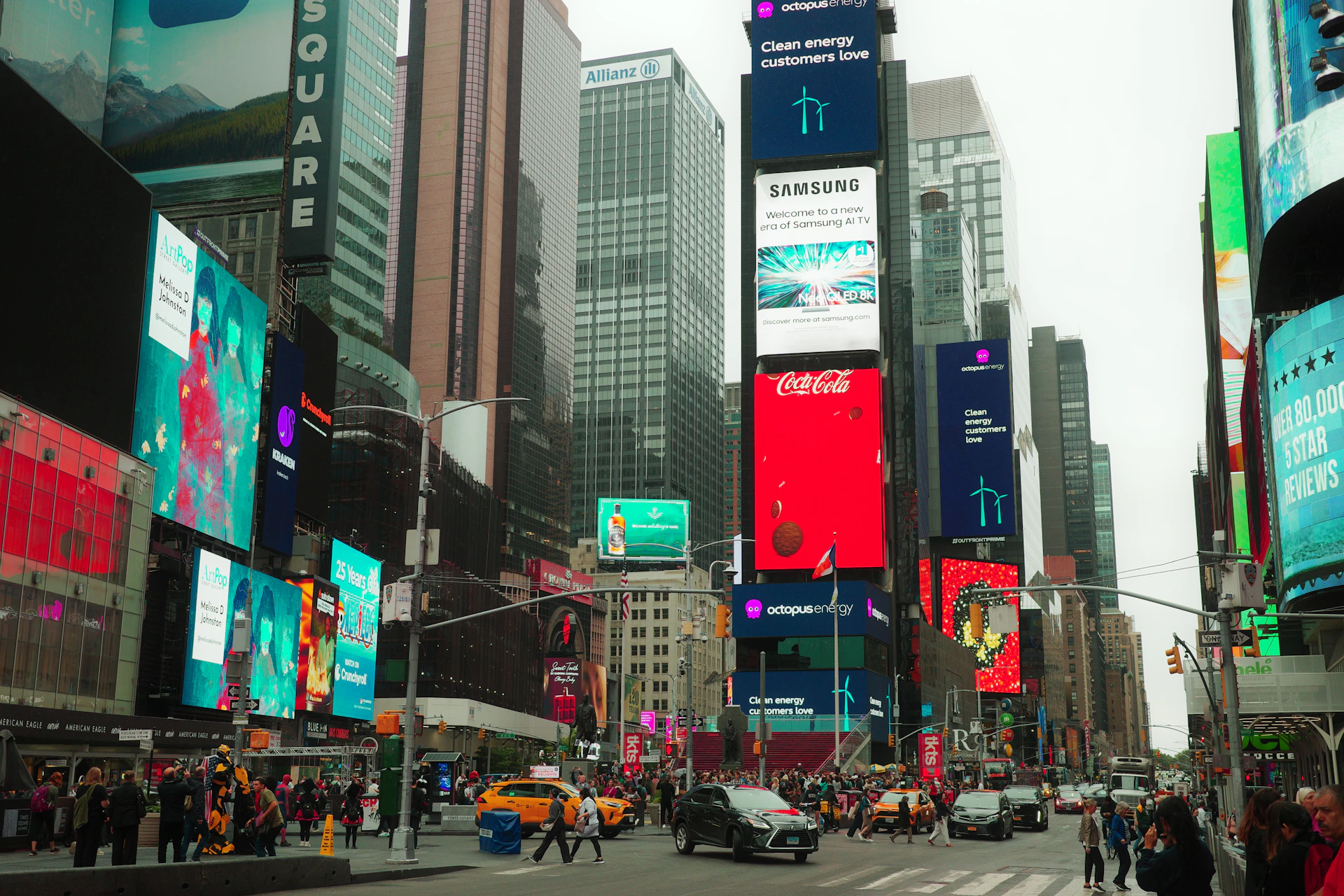 A city street filled with lots of tall buildings