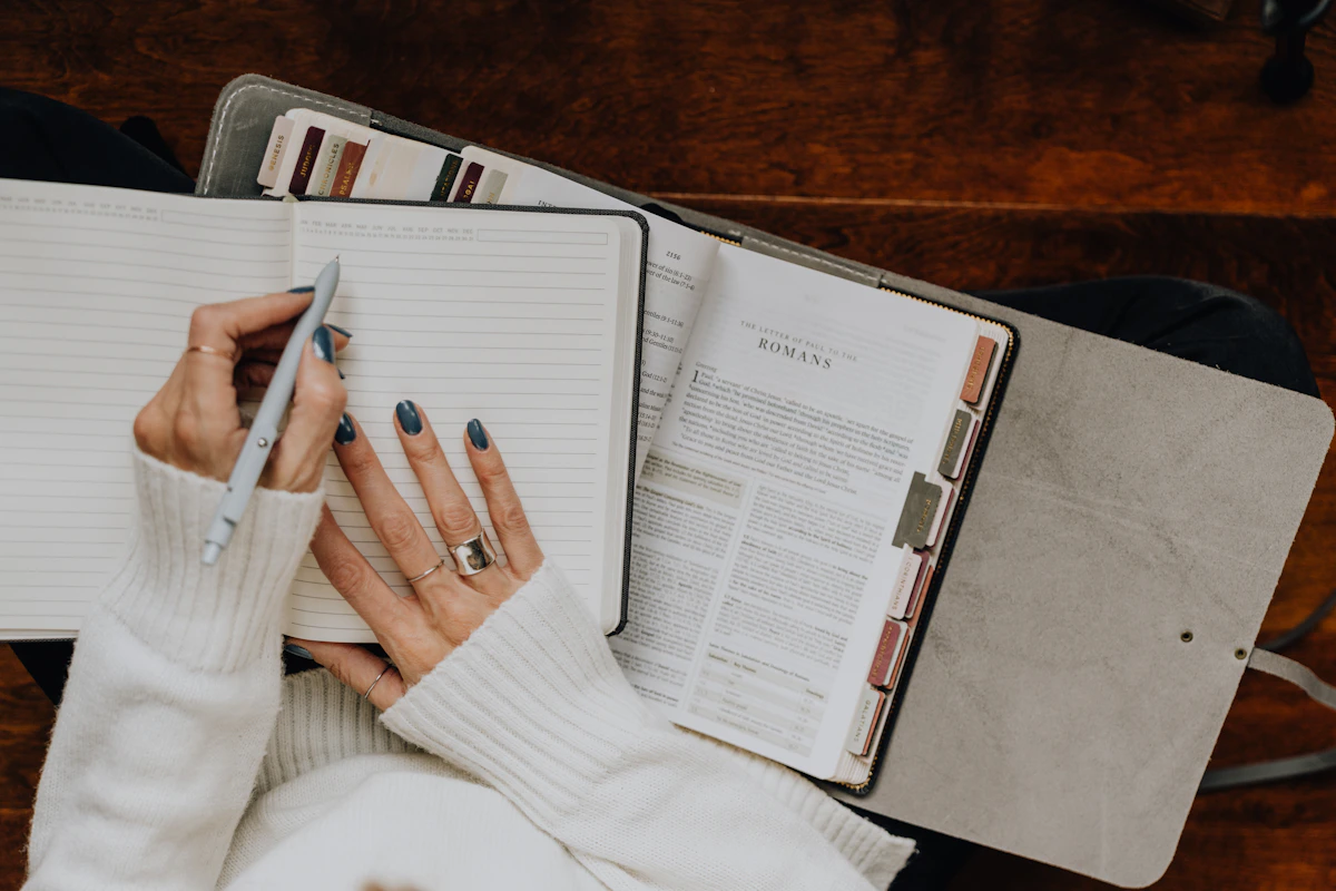 Black woman using a notebook to plan and pace her day