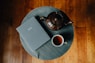 A cup of tea and a book on a table