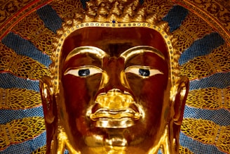 A golden buddha statue sitting in a room