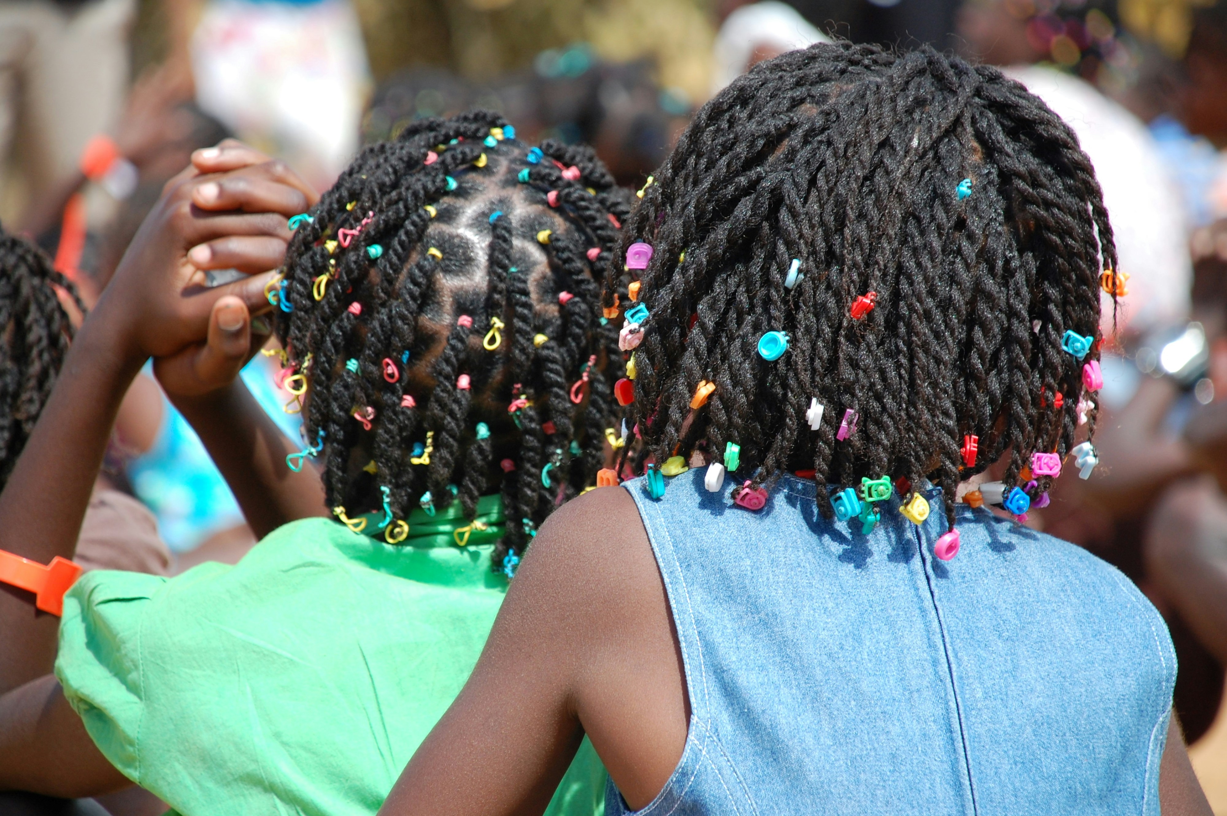 Two young african american children with cornrows