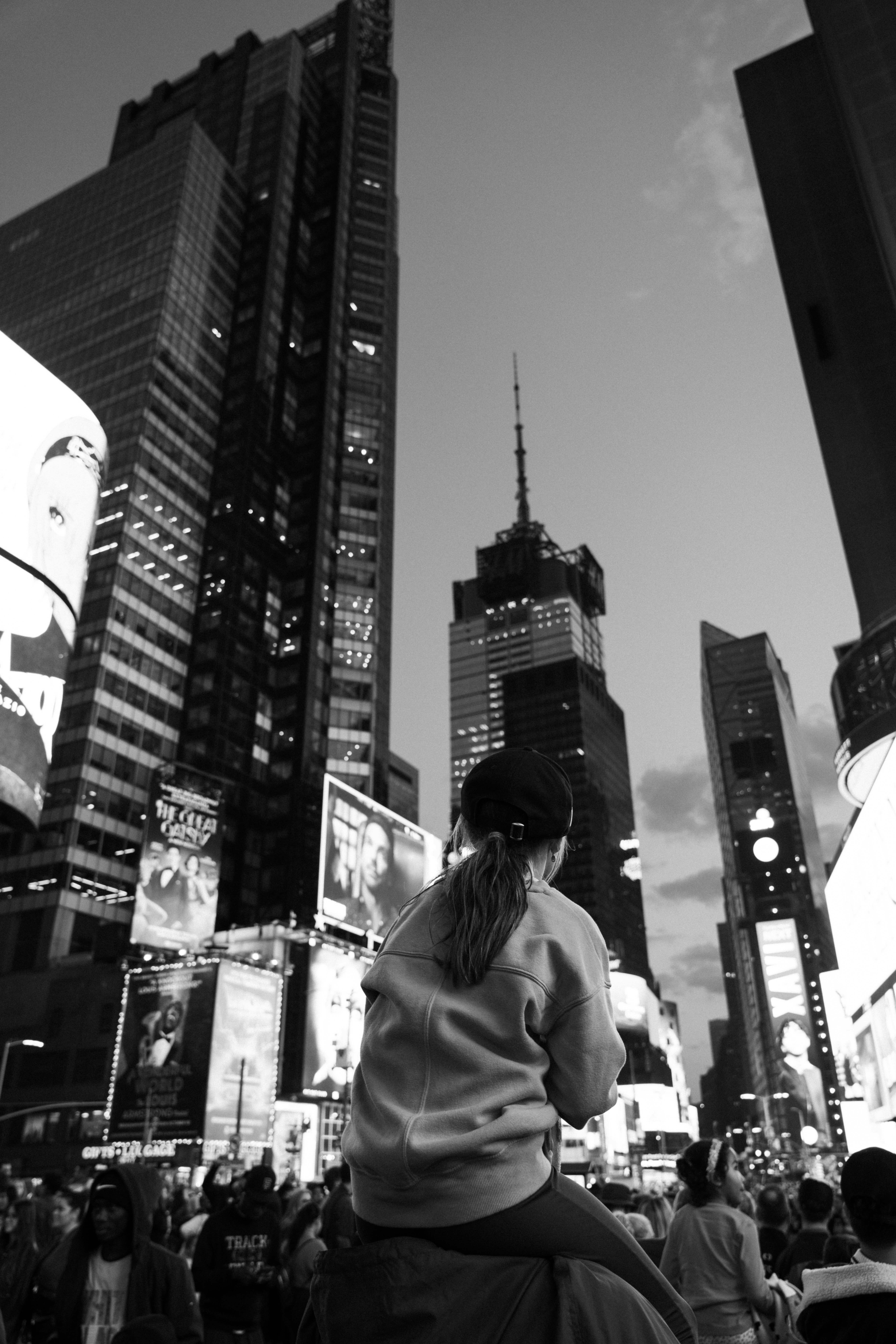 A black and white photo of a woman riding a skateboard