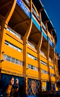 A large yellow building with many windows on it