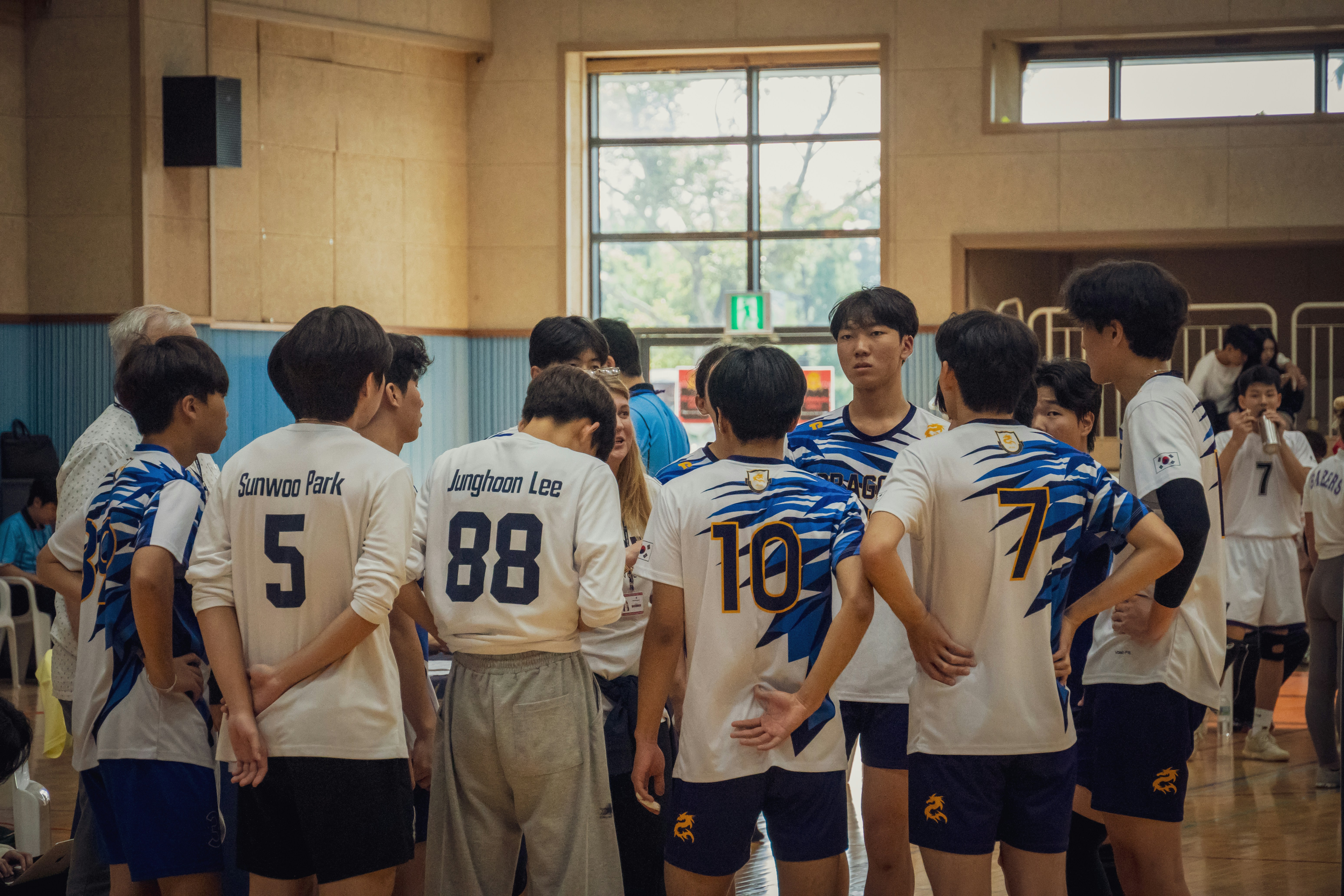 A group of young men standing next to each other