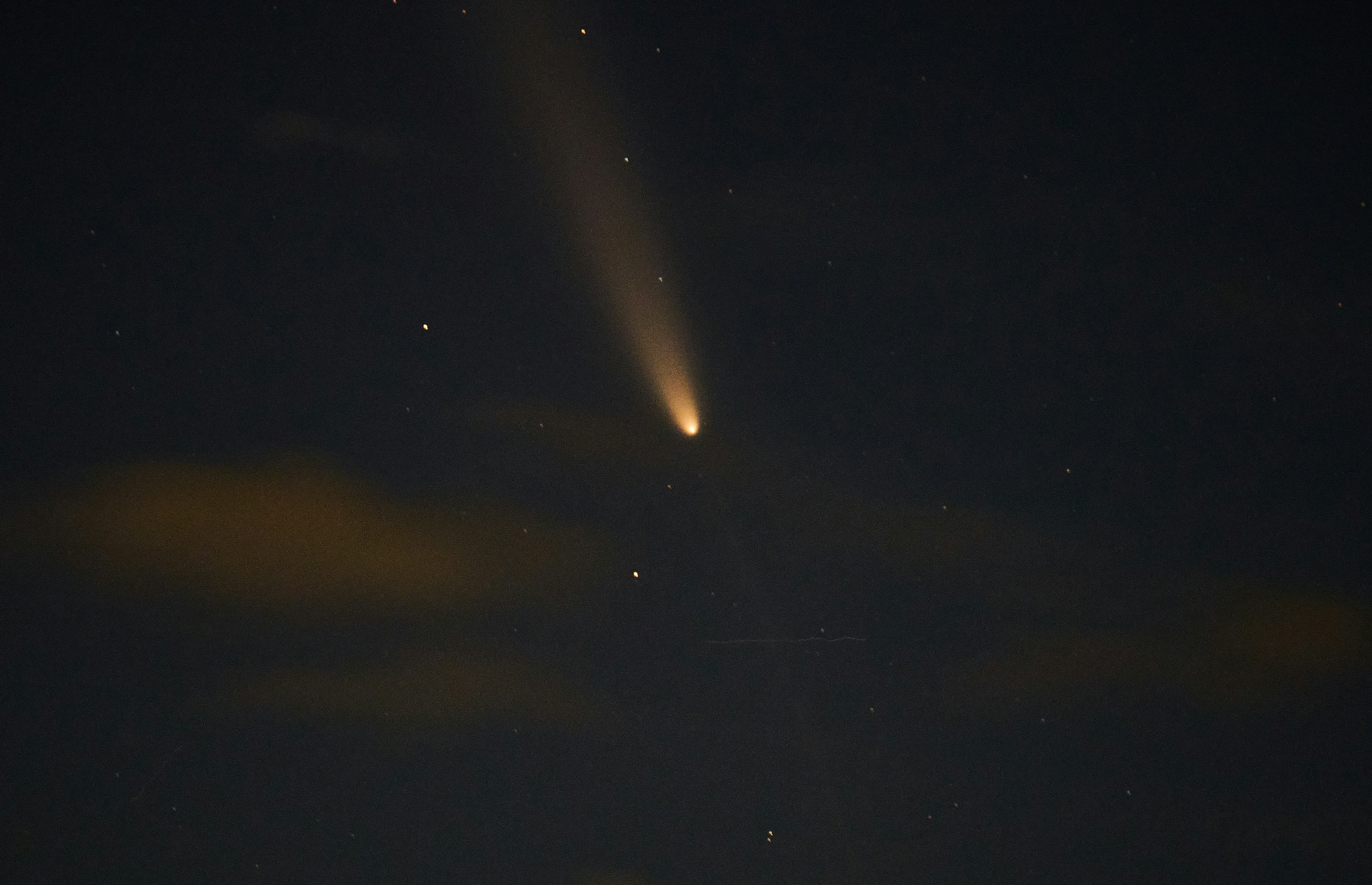 A bright light shines in the night sky