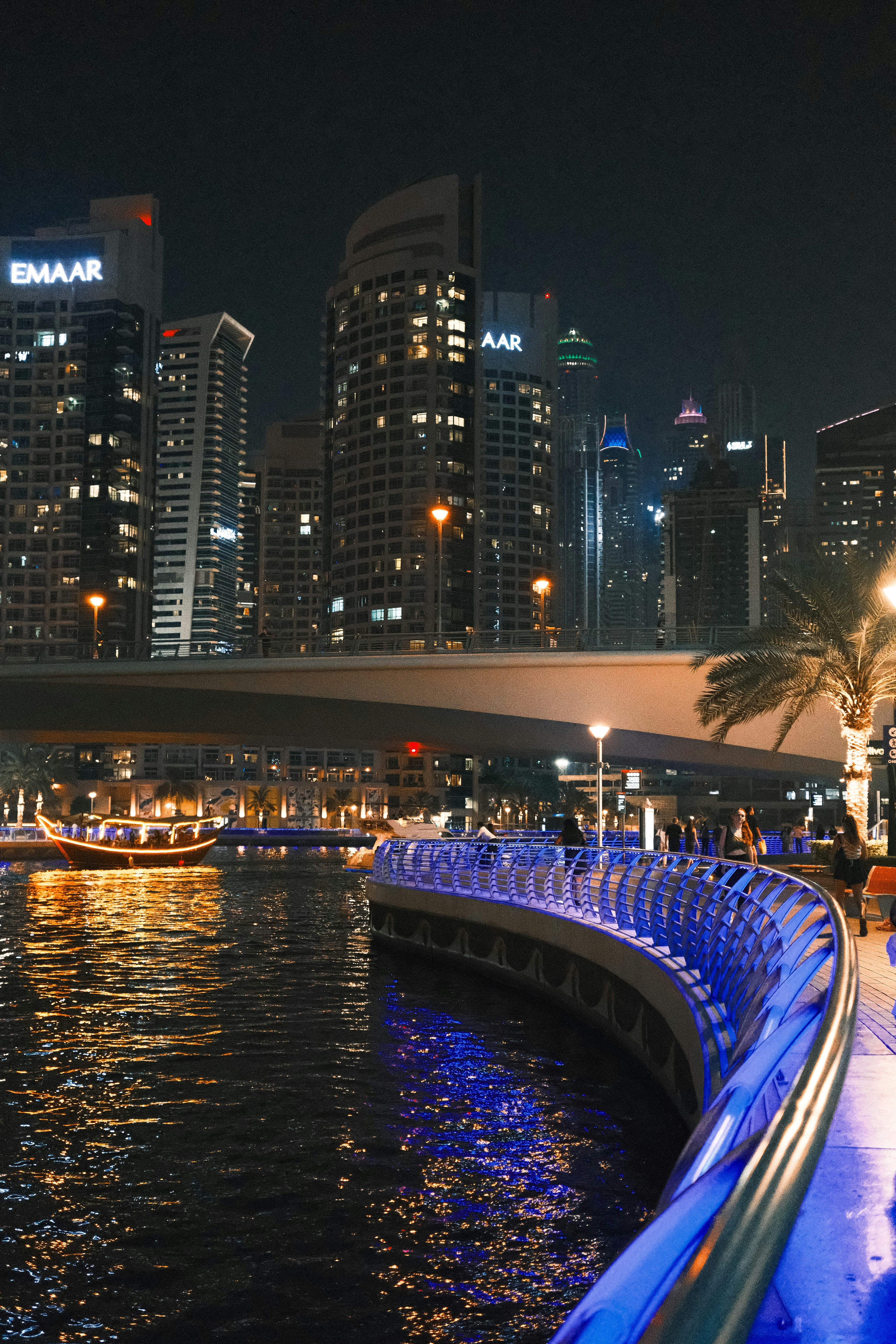 A view of a city at night from the water