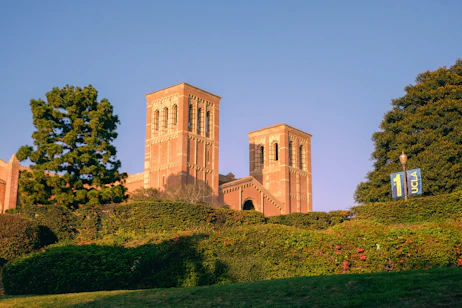 A building with two towers on top of a hill