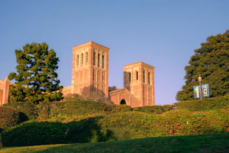 A building with two towers on top of a hill