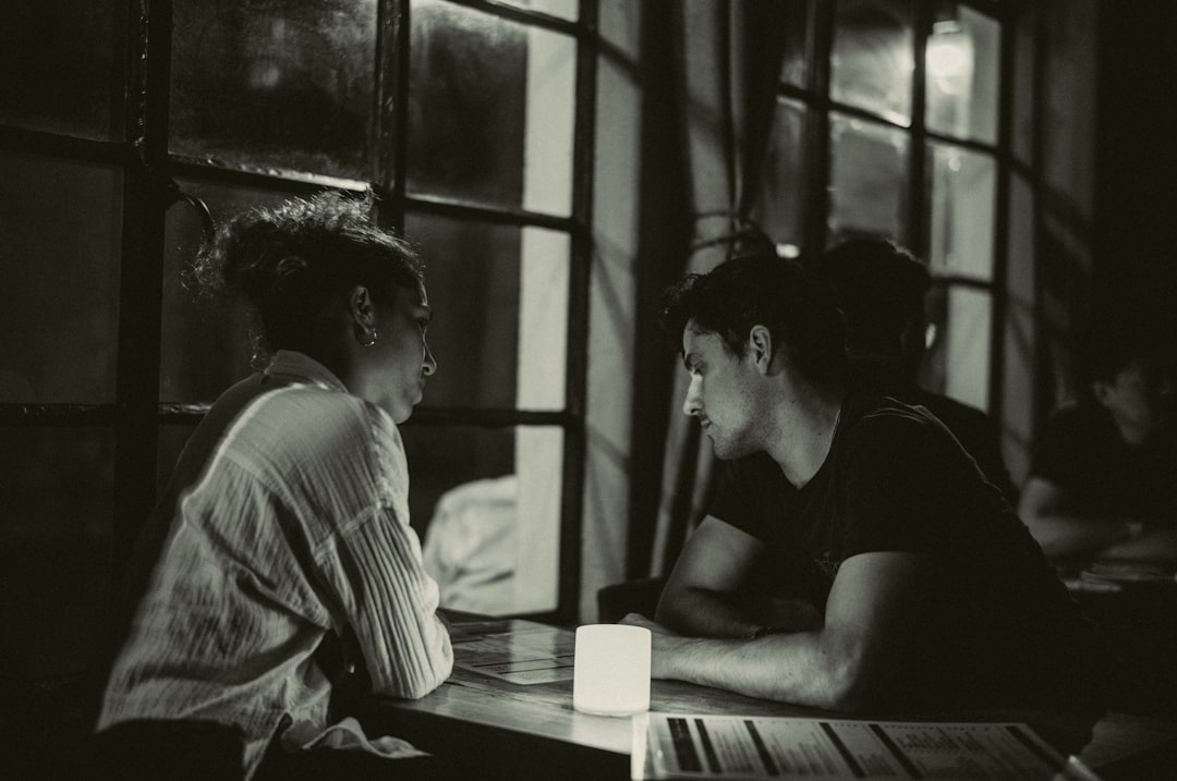 A couple of people sitting at a table,