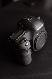 A camera sitting on top of a black table