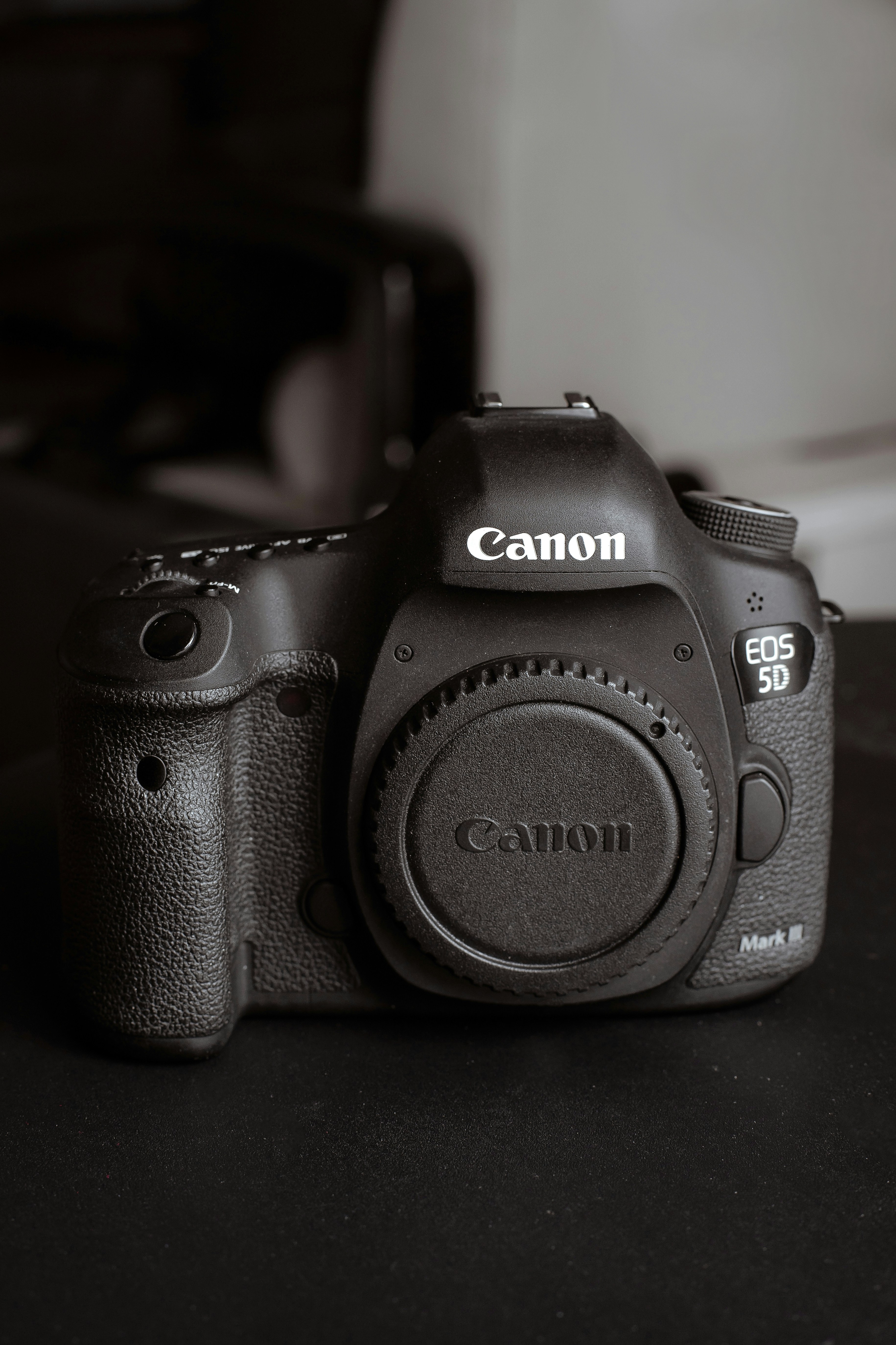 A black and white photo of a camera