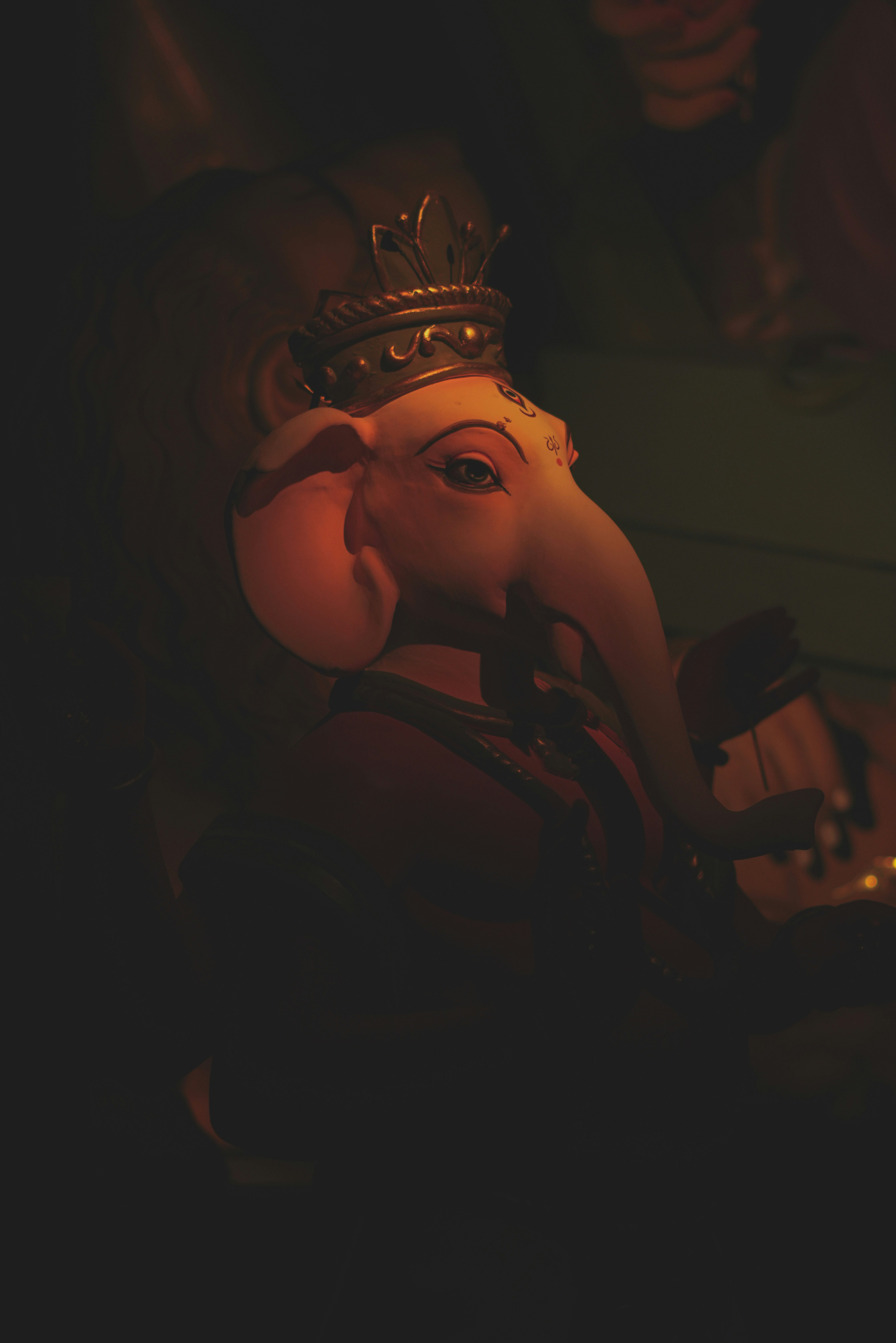 A statue of an elephant with a crown on it's head