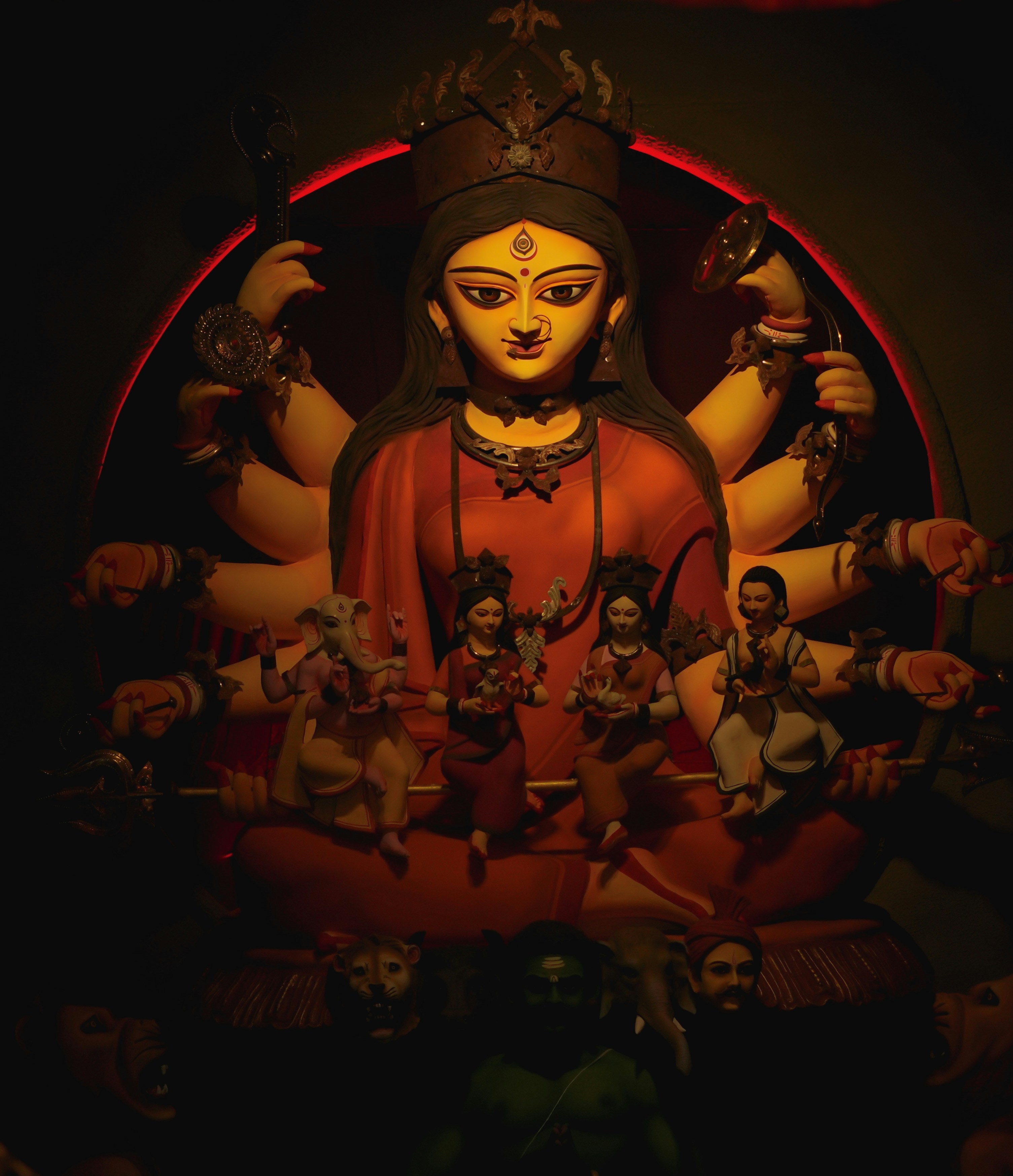 A statue of a buddha surrounded by other statues