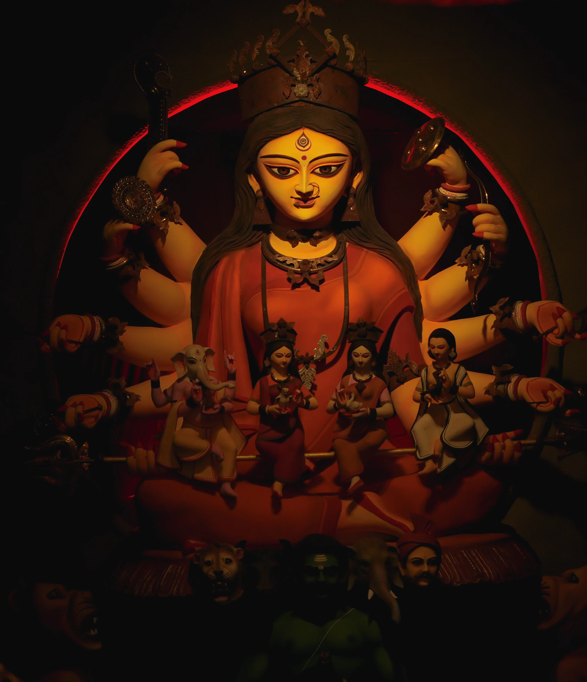 A statue of a buddha surrounded by other statues