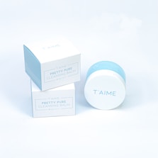 A white box with a blue lid next to a white box with a blue lid
