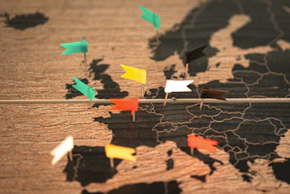 A map of the world with pins pointing in different directions