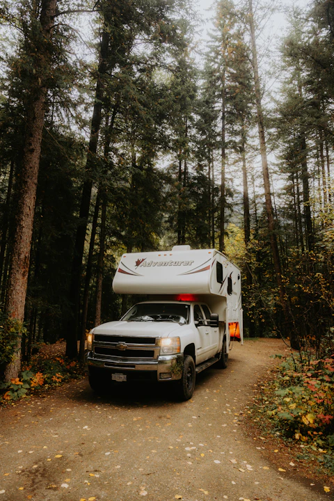 Motorhome parked at a wooded campsite