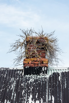 A pile of bricks sitting on top of a metal roof