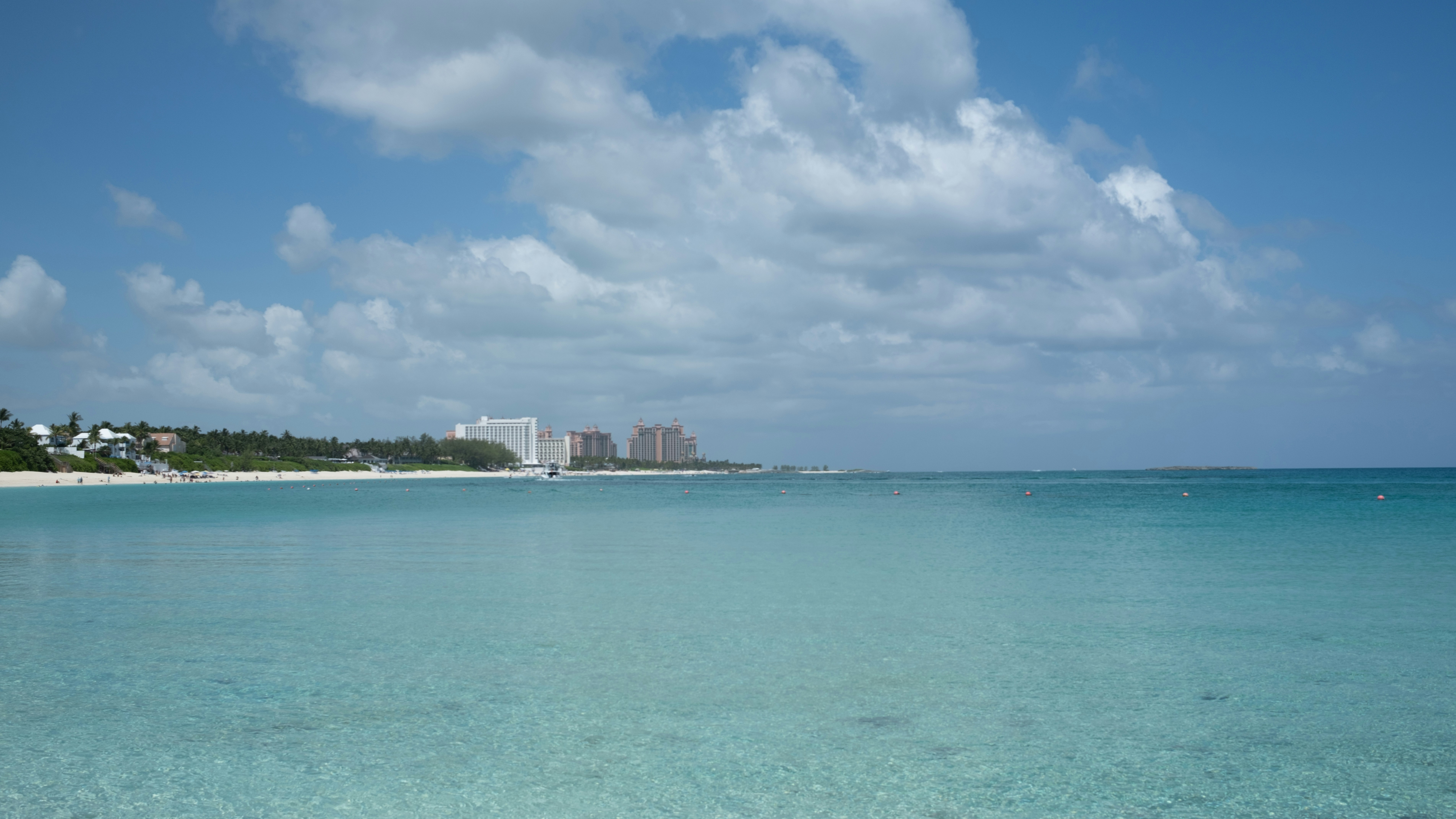 A body of water with a beach in the background, Nassau, The Bahamas, Summer, Water, Clouds, Beach, Sand, Hotel Resorts, Caribbean, Aqua Water, Locals, MSC, Cruise Ships, Port Nassau