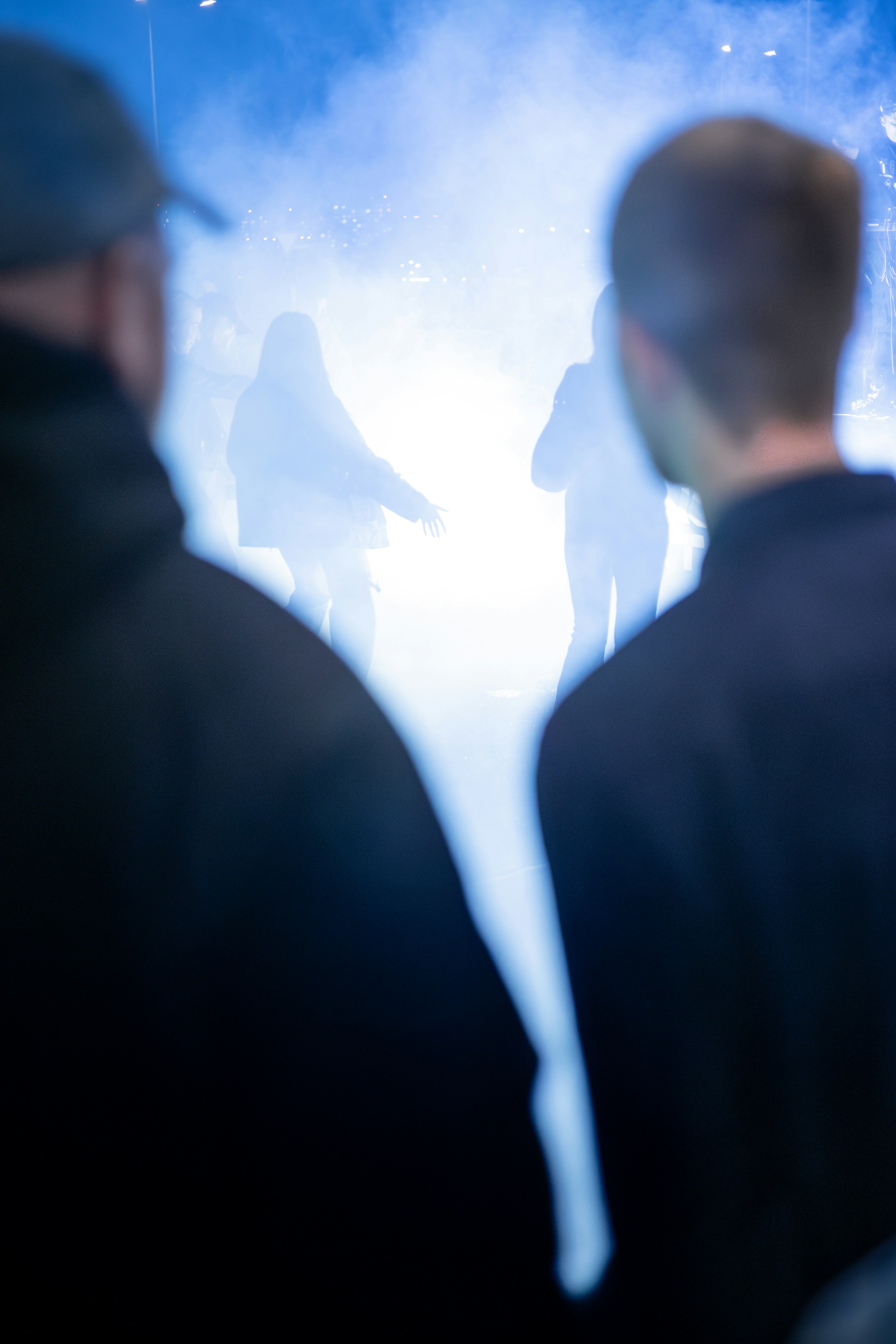 A group of people standing in front of a stage