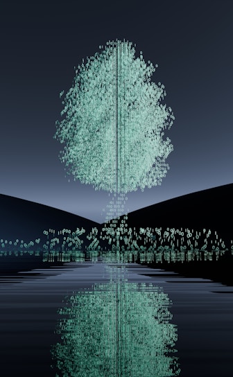 A tree is reflected in the water at night