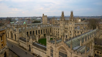 An aerial view of a large building with a clock tower