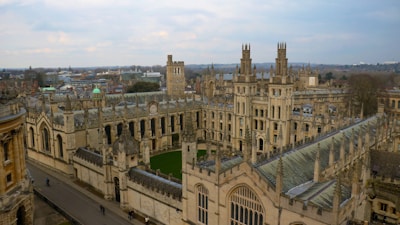 An aerial view of a large building with a clock tower