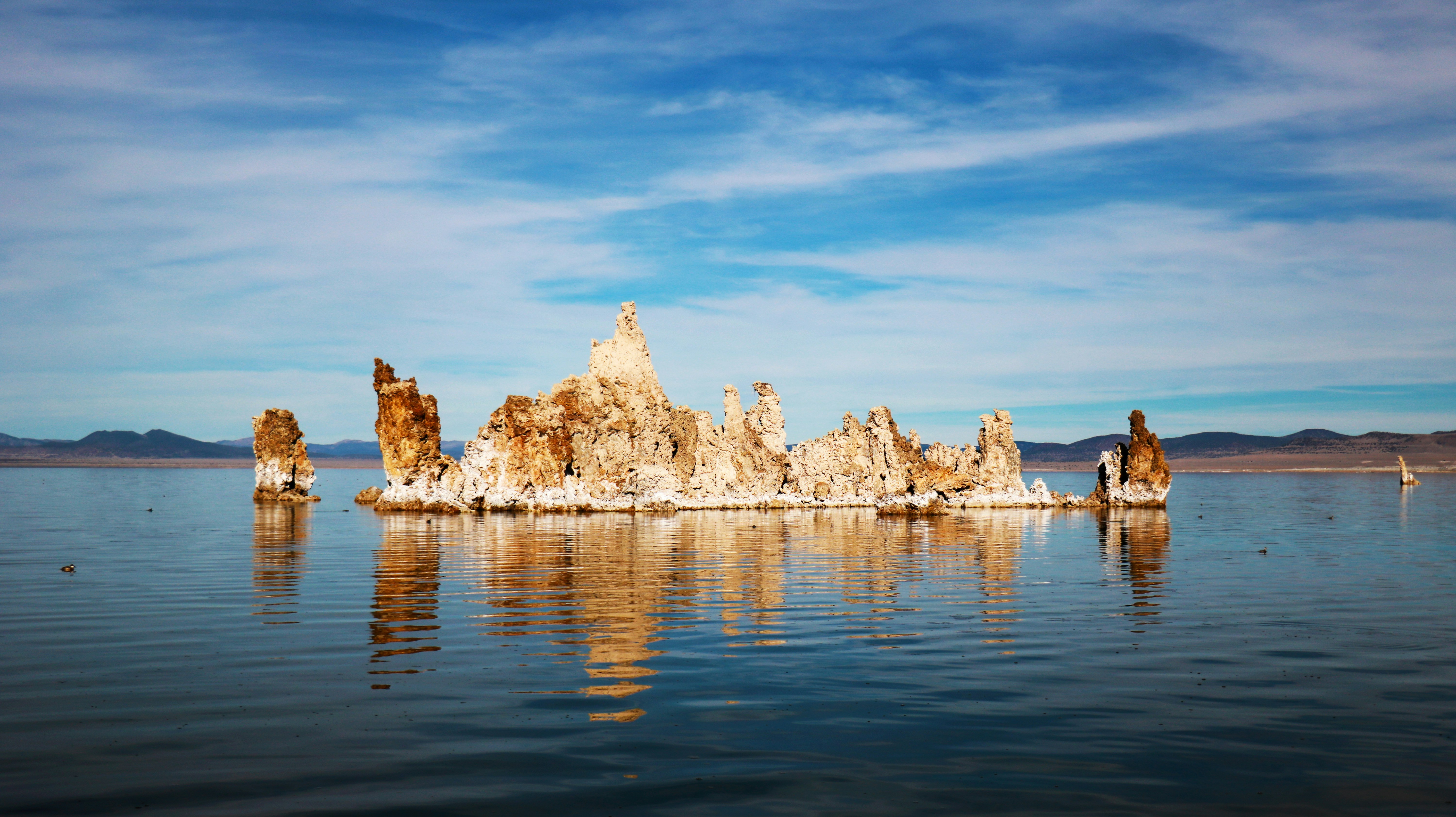 A large body of water with rocks in it
