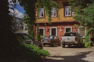 A truck is parked in front of a house