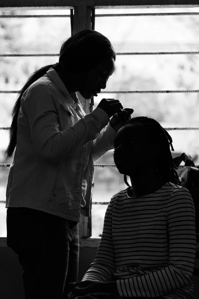 A stylist working on a client in the studio