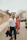 A man and a woman walking down a street