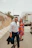 A man and a woman walking down a street