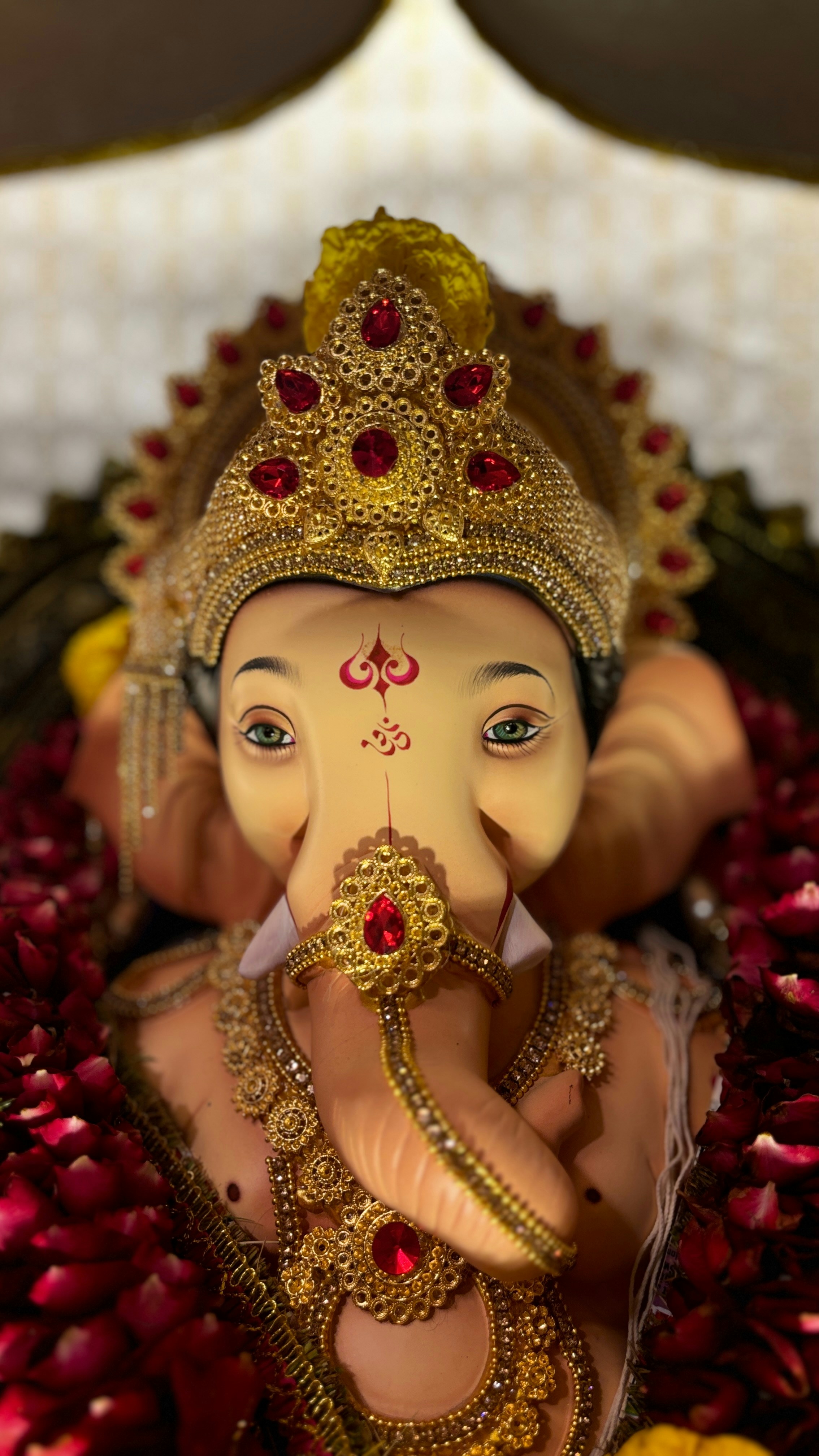 A statue of an elephant with a crown on its head