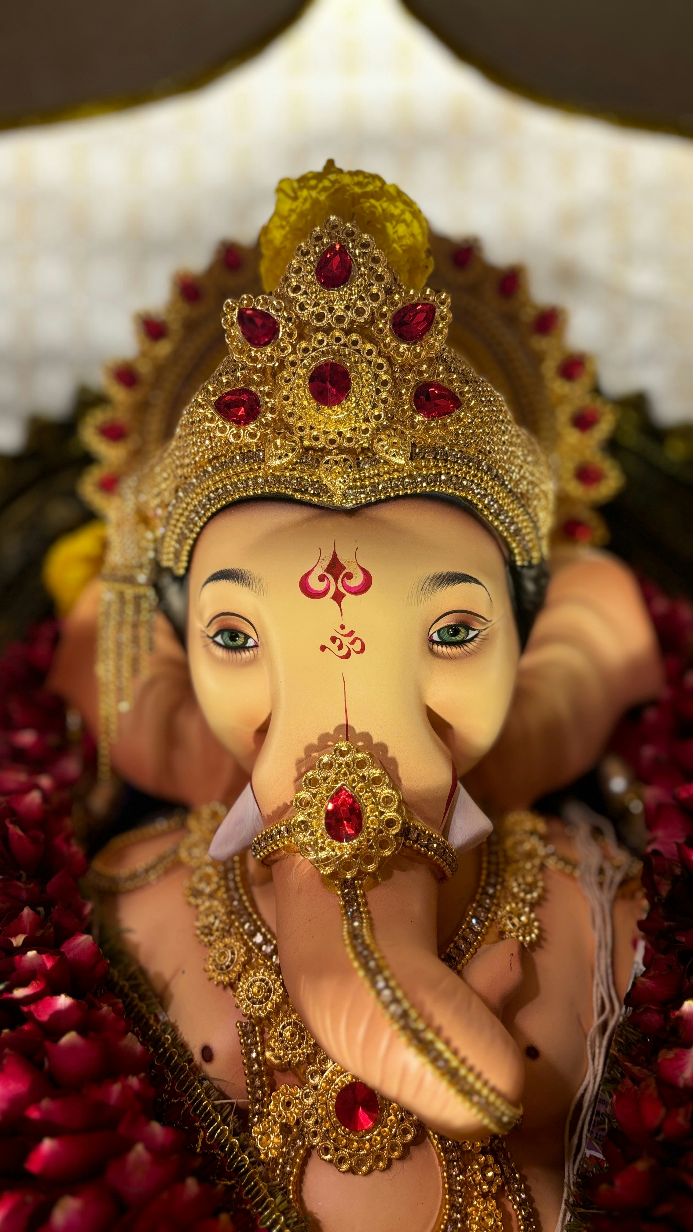 A statue of an elephant with a crown on its head