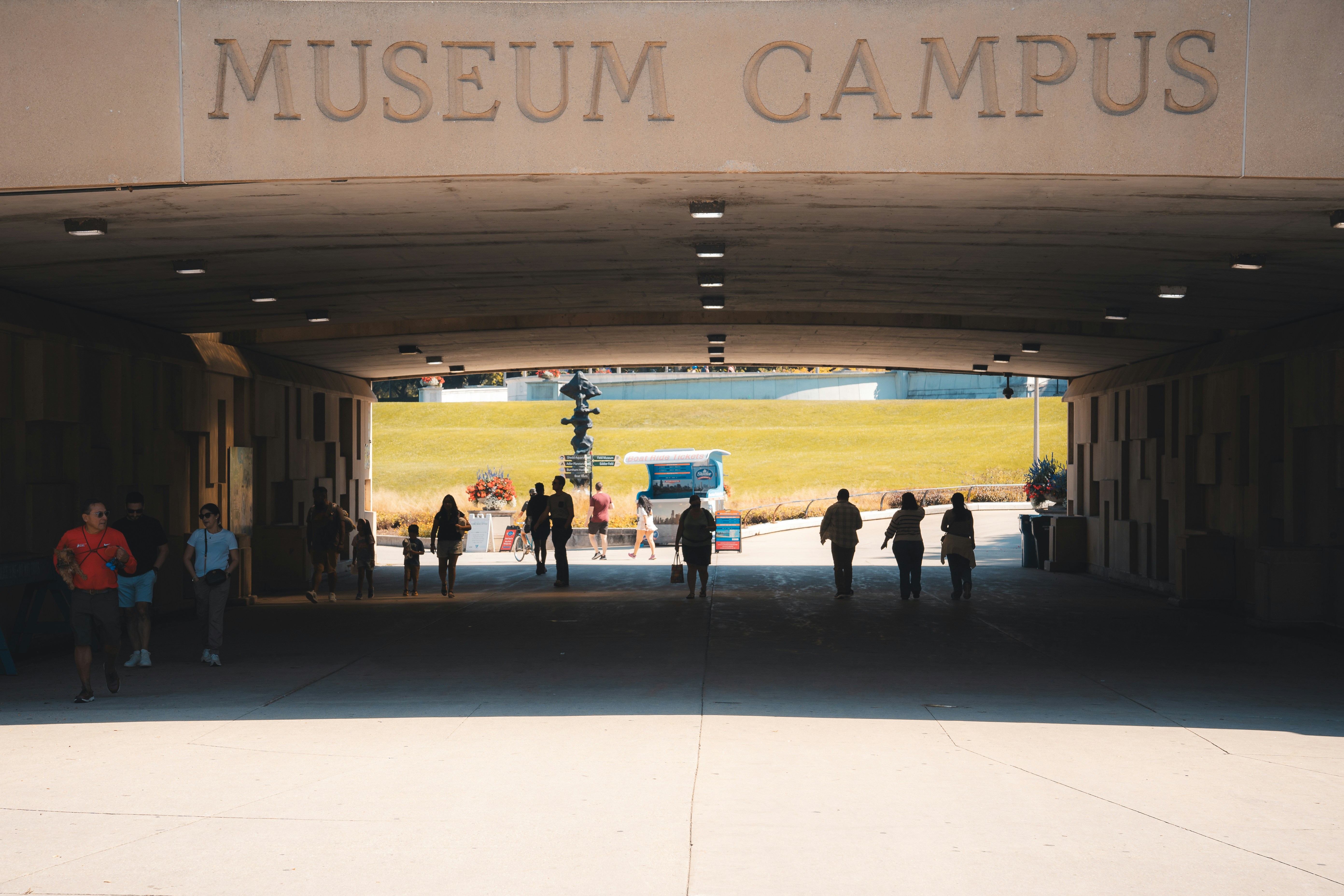 A group of people standing outside of a museum