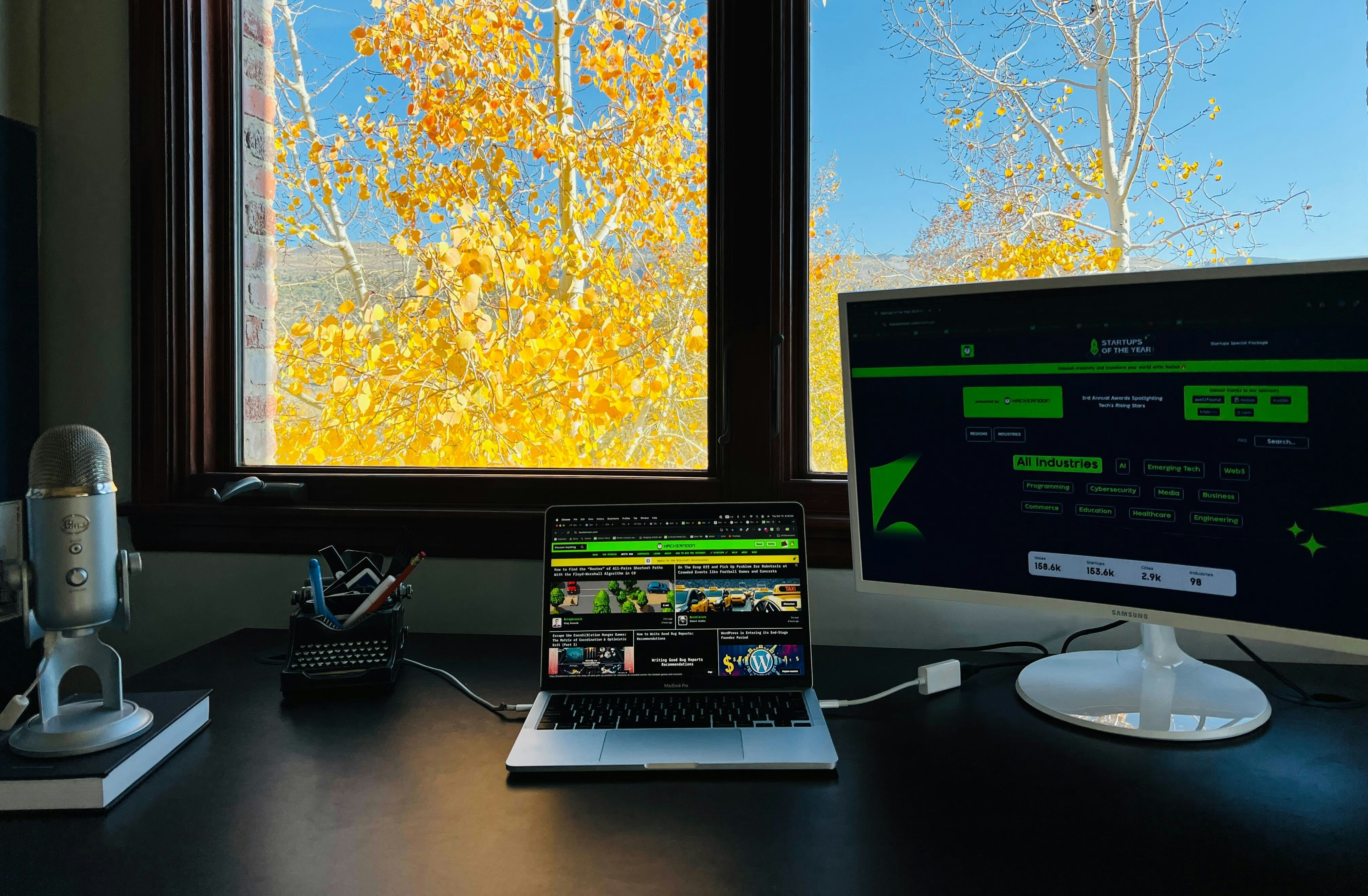Office view with HackerNoon and yellow leaves.