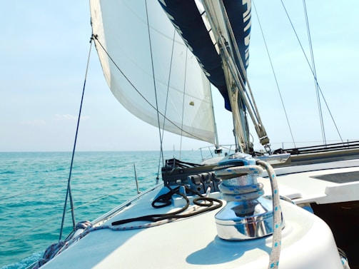 A sailboat is sailing in the open water