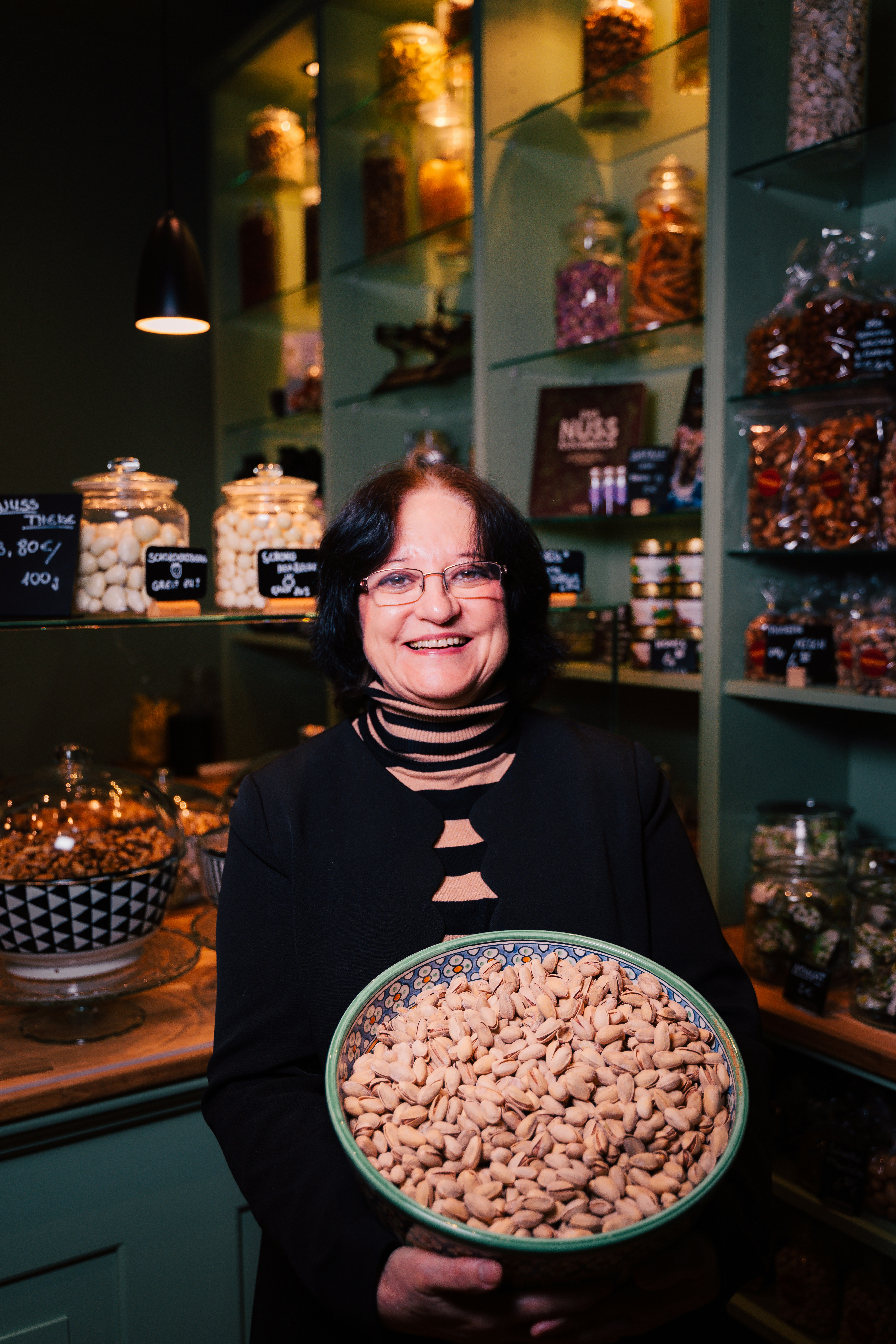 A woman holding a bowl of cereal in a store