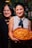 Two women holding a tray of food in their hands